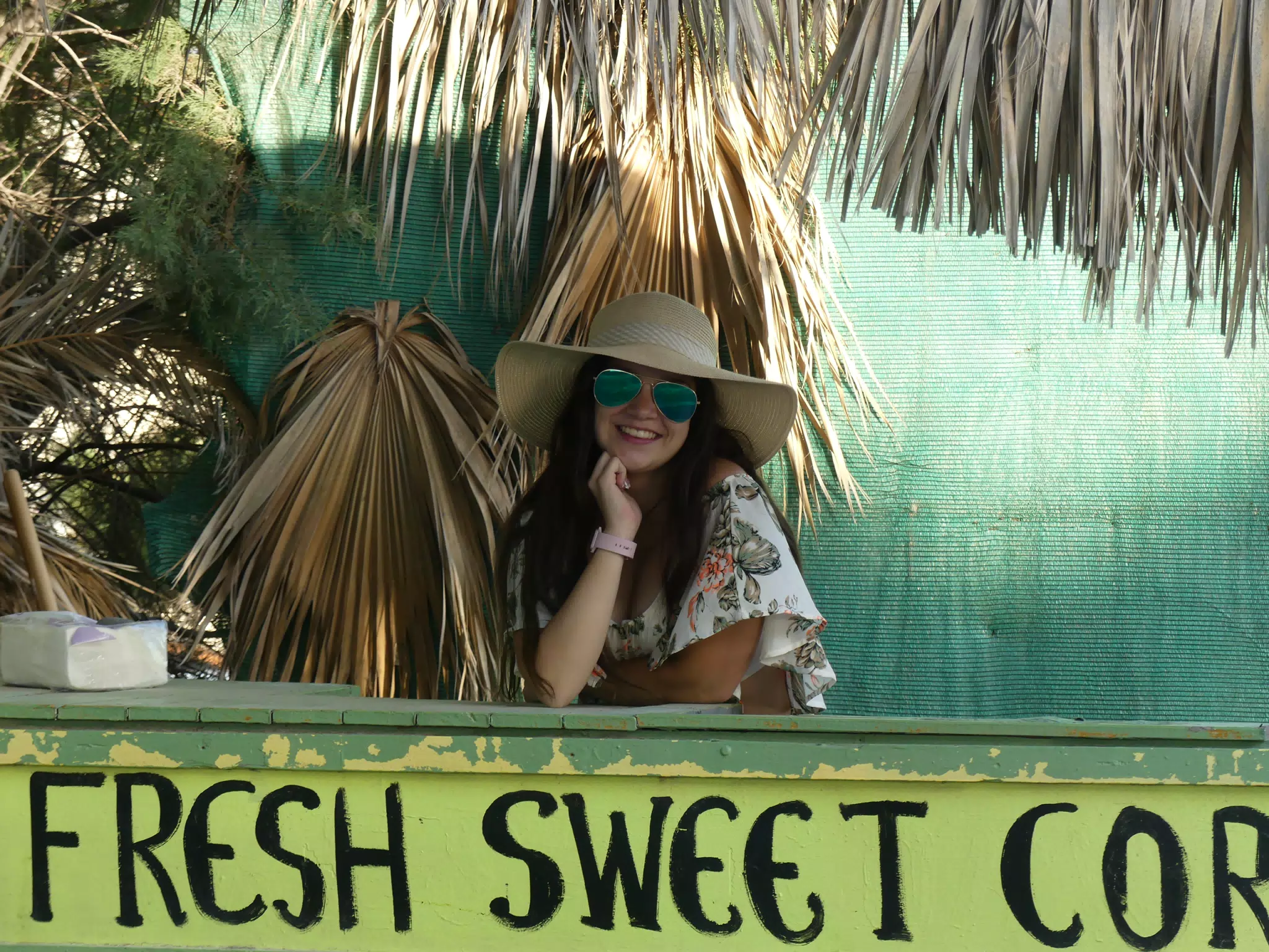 Girl in Corn Stand