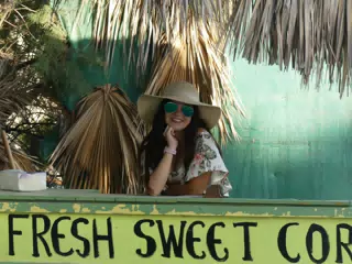 Girl in Corn Stand