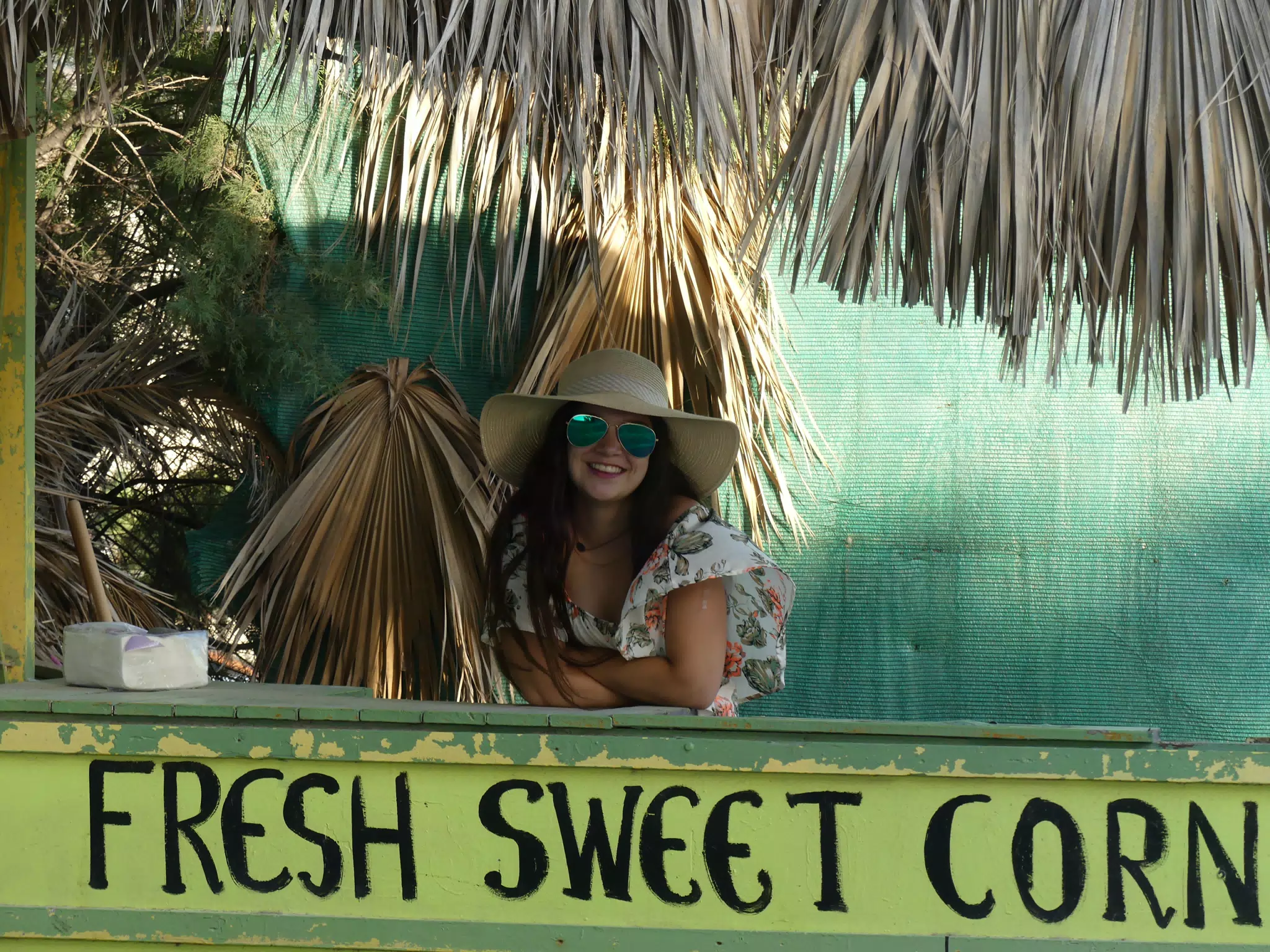 Teen Girl Selling Fresh Sweet Corn on Santorini