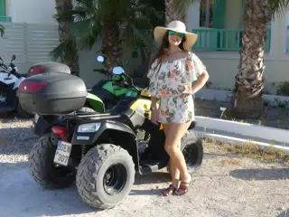 Teen Girl by ATV on Santorini