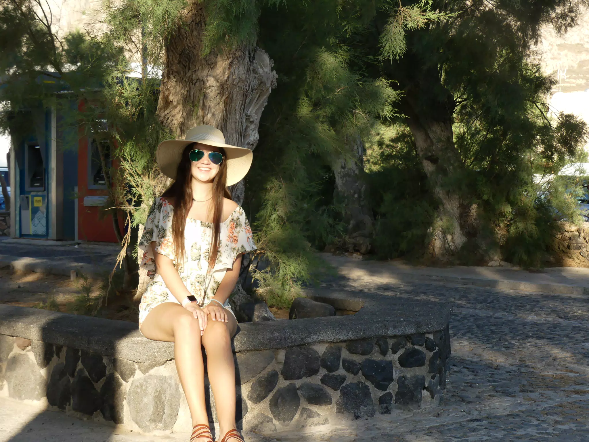 Emily Sitting Under Tree on Santorini