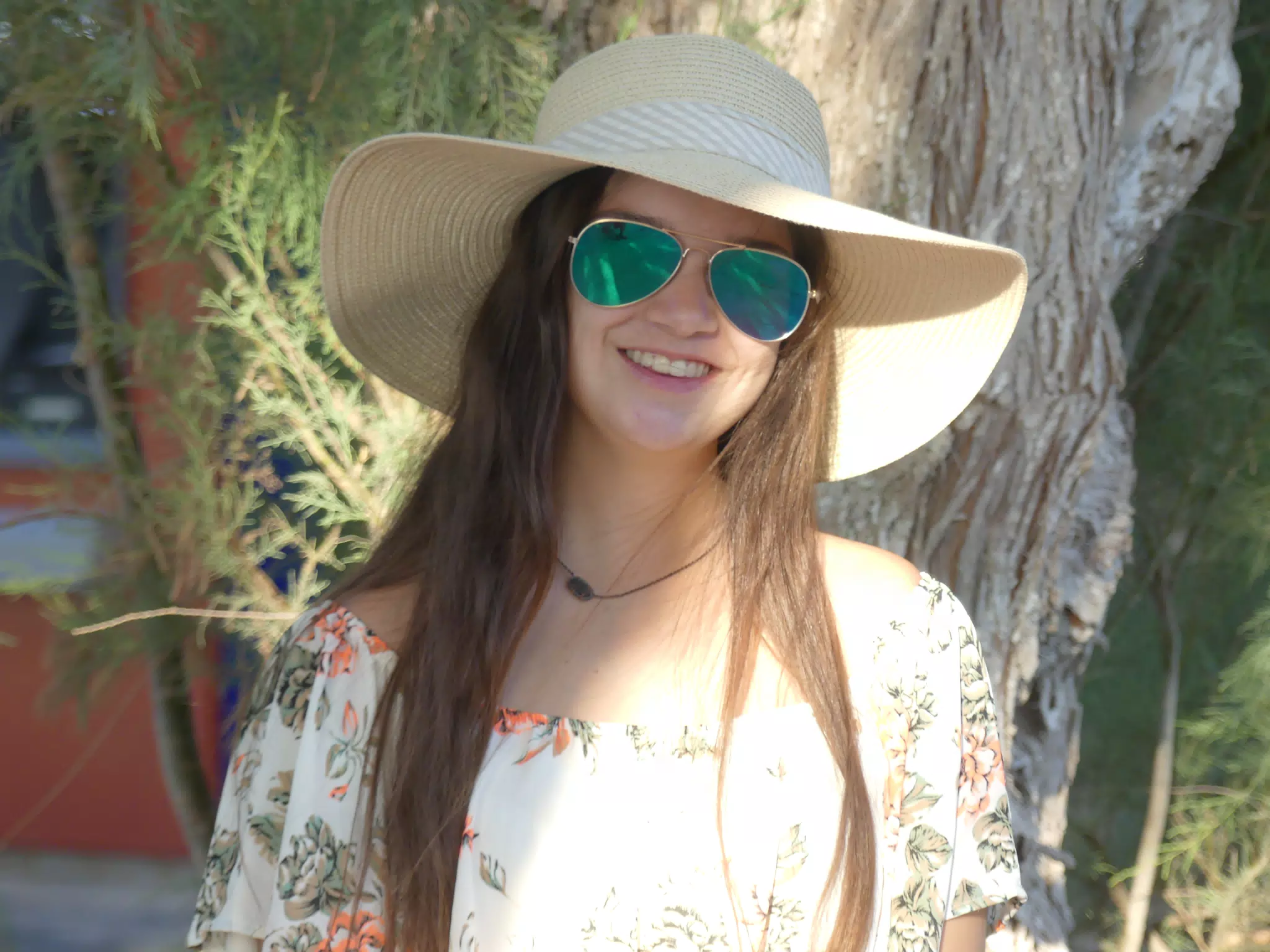 Emily in Hat by Tree