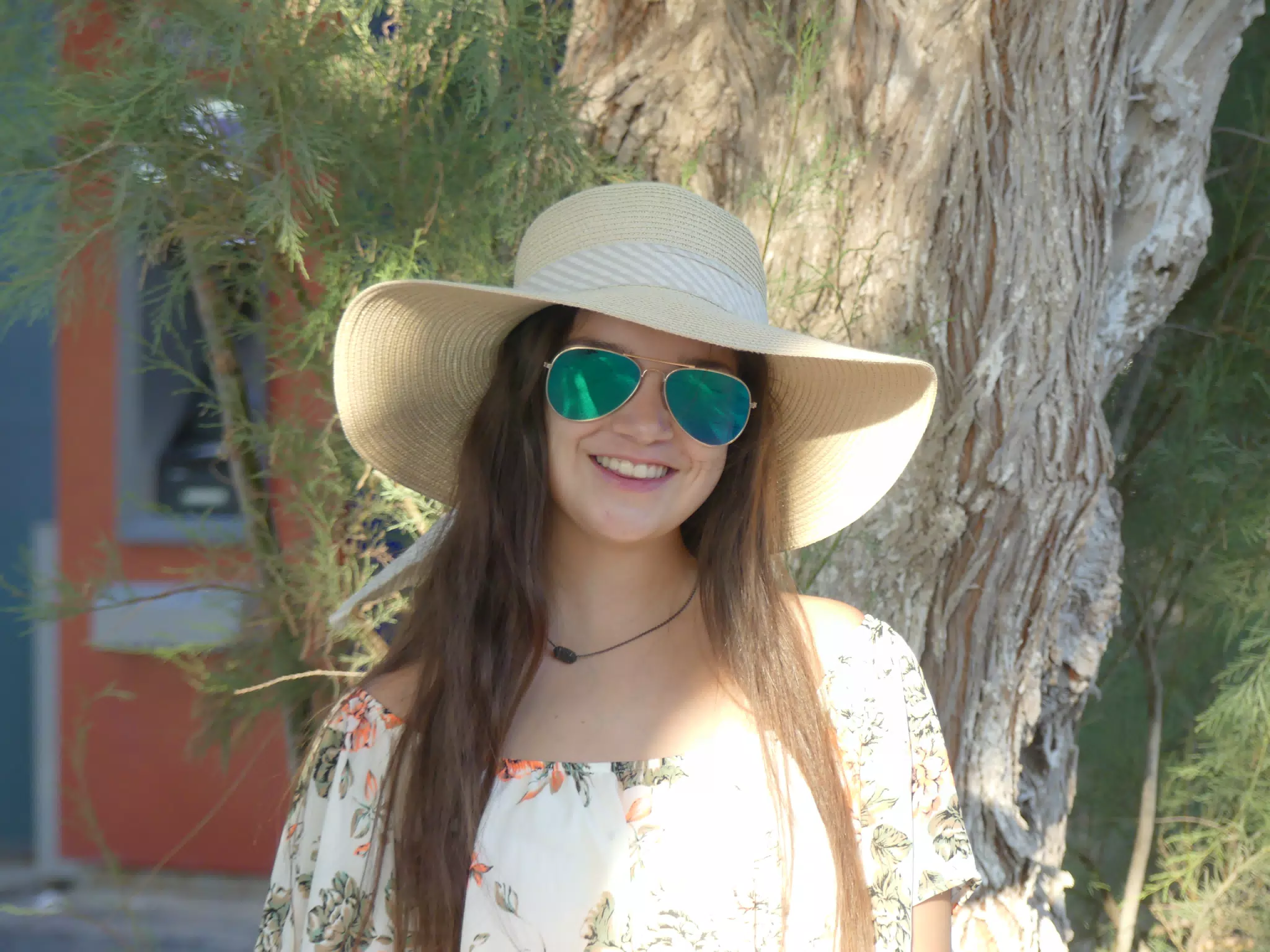 Emily in Hat by Tree