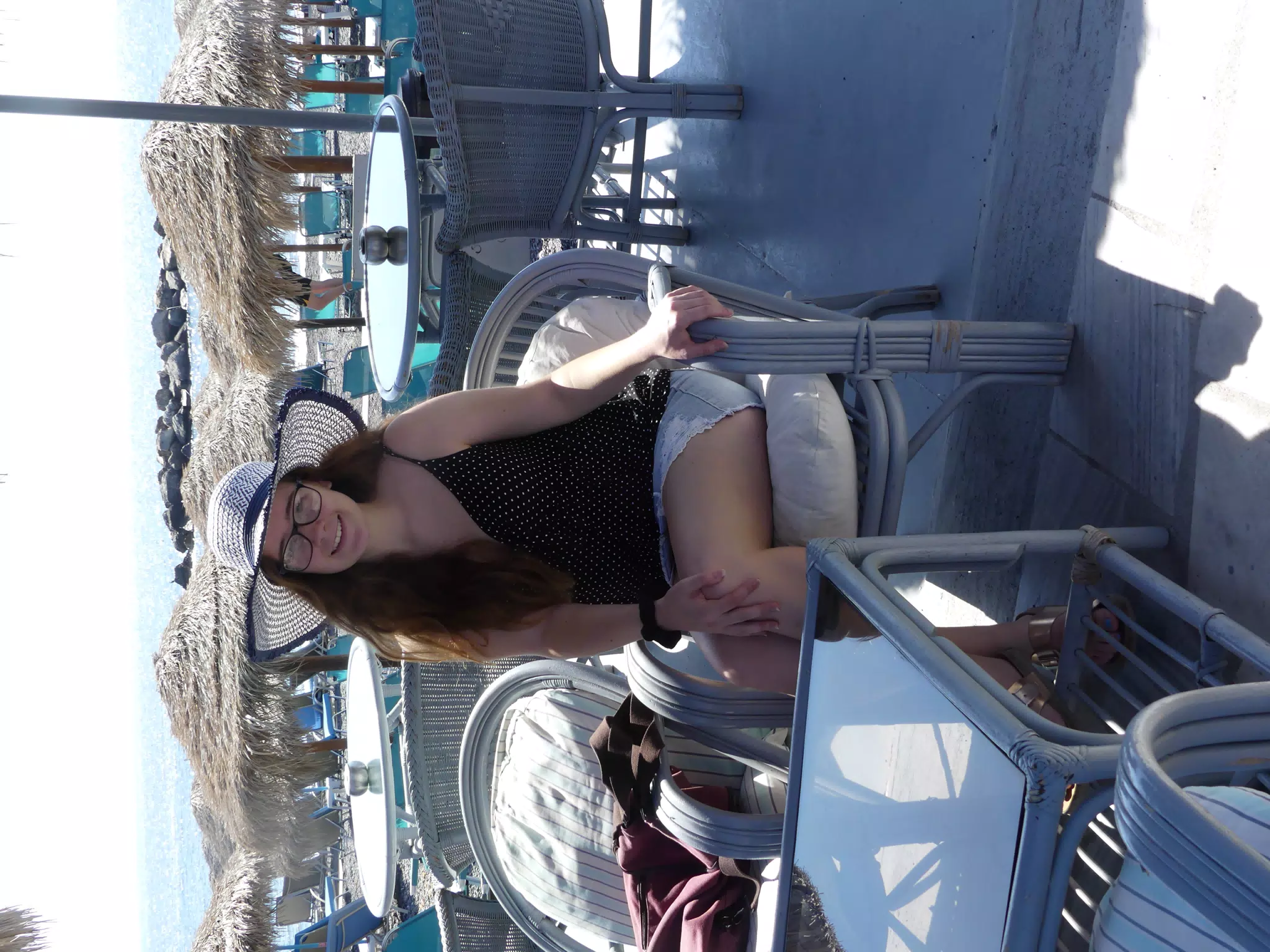 Madeline on Beach on Santorini in Hat and Skirt