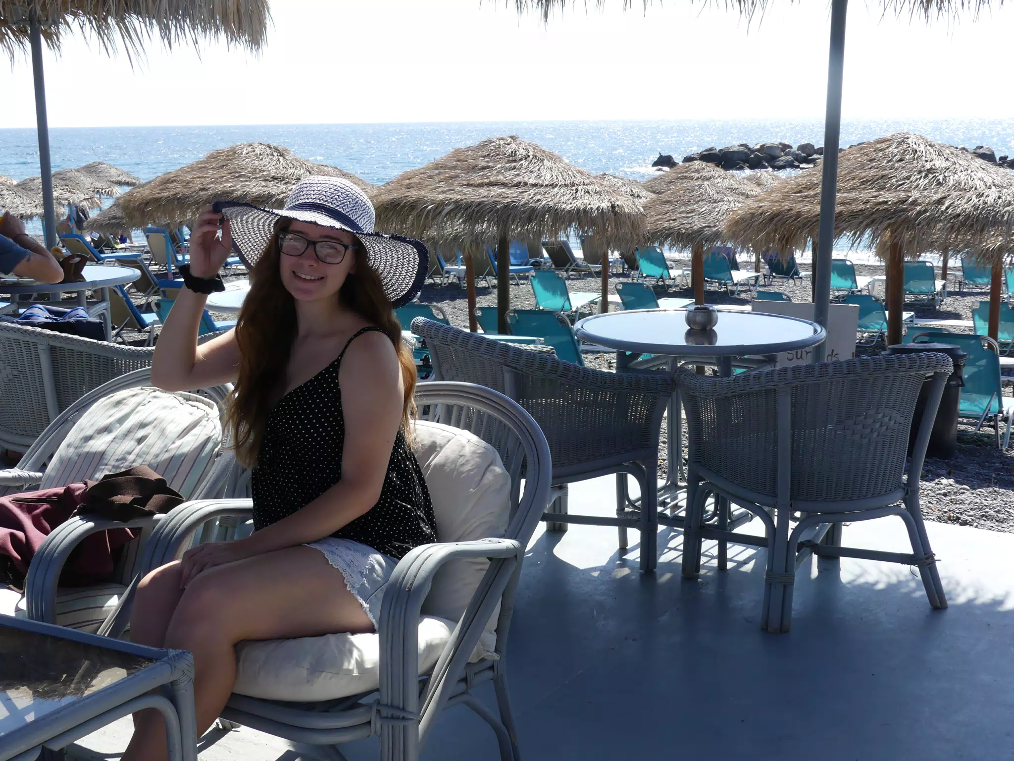 Girl on Kamari Beach in Hat