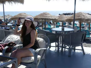 Girl on Kamari Beach in Hat