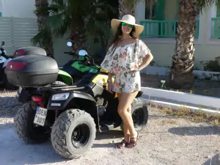 Teen Girl by ATV on Santorini