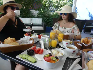 Dominica and Emily Having Breakfast in Kamari
