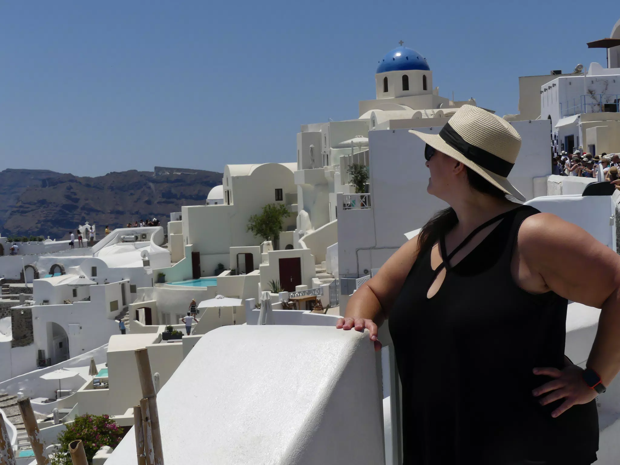 Dominica in Hat in Oia, Santorini