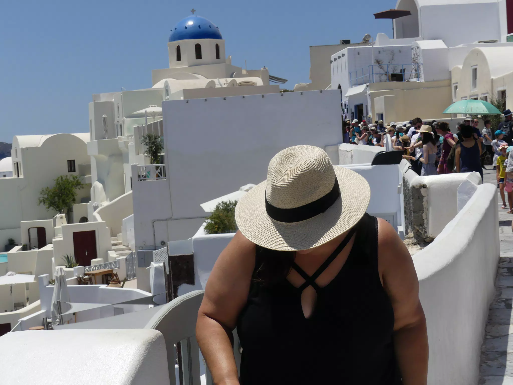 Dominica in Hat in Oia, Santorini