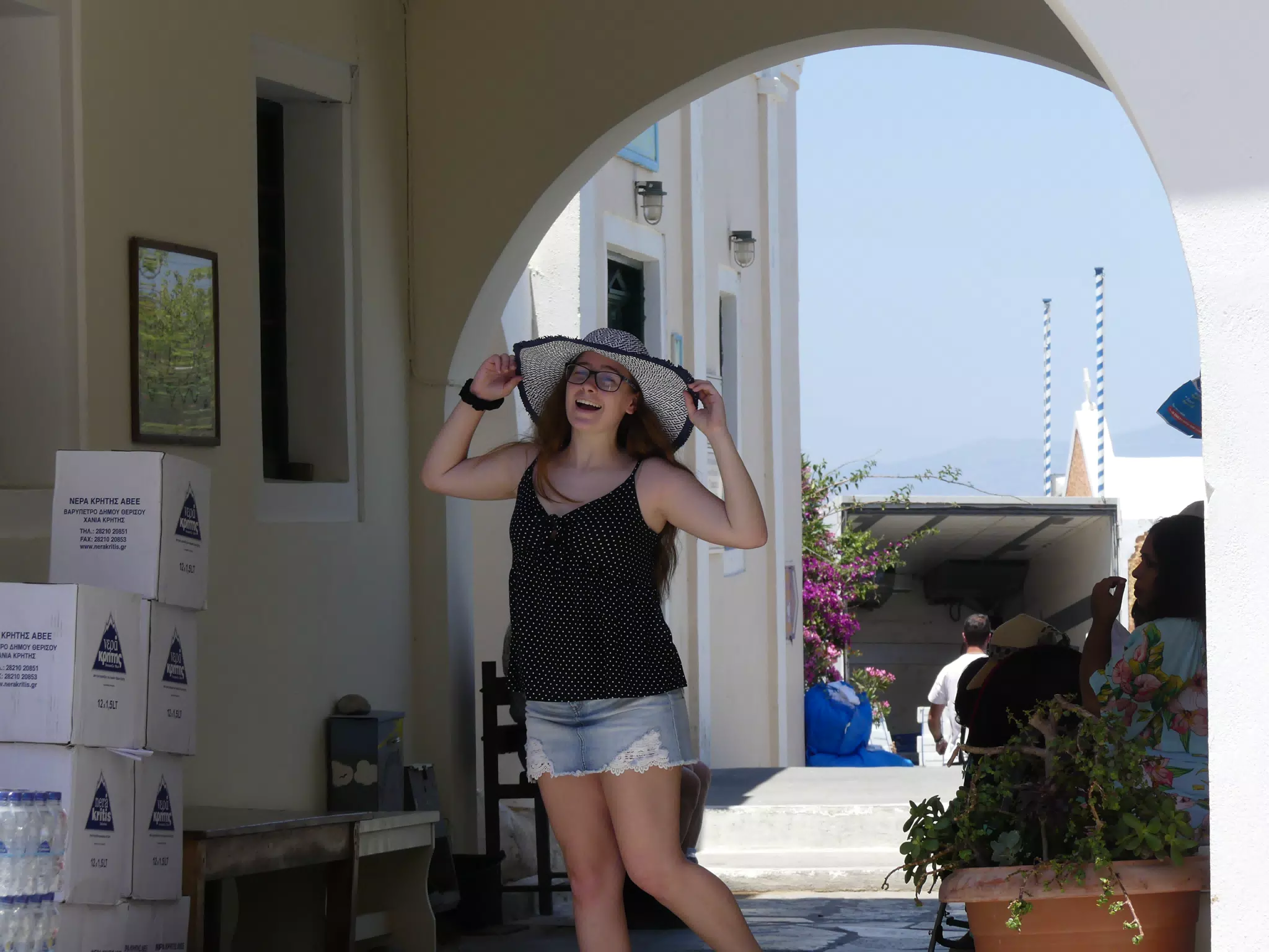 Madeline Laughing in Hat on Oia