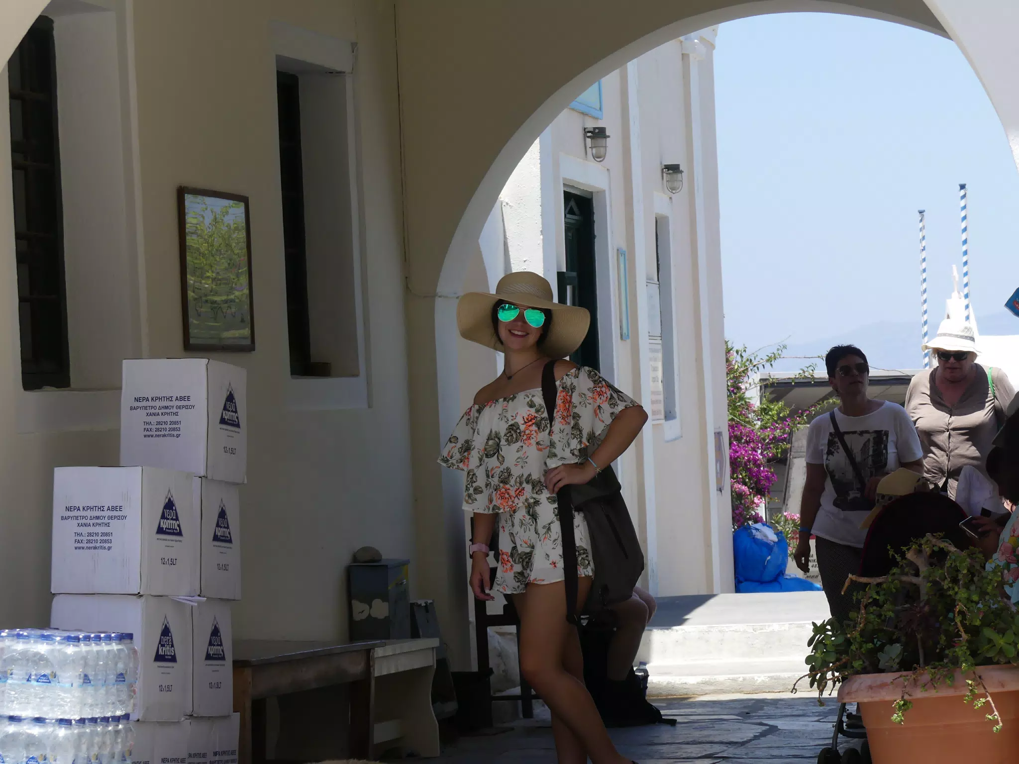 Emily in Hat and Sunglasses in Oia, Santorini
