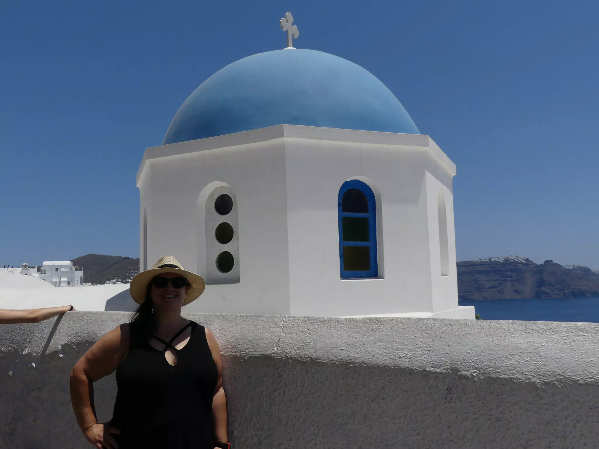 Dominica at the Blue Dome in Oia, Santorini