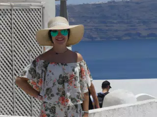 Emily in Hat in Oia, Santorini in Front of the Sea