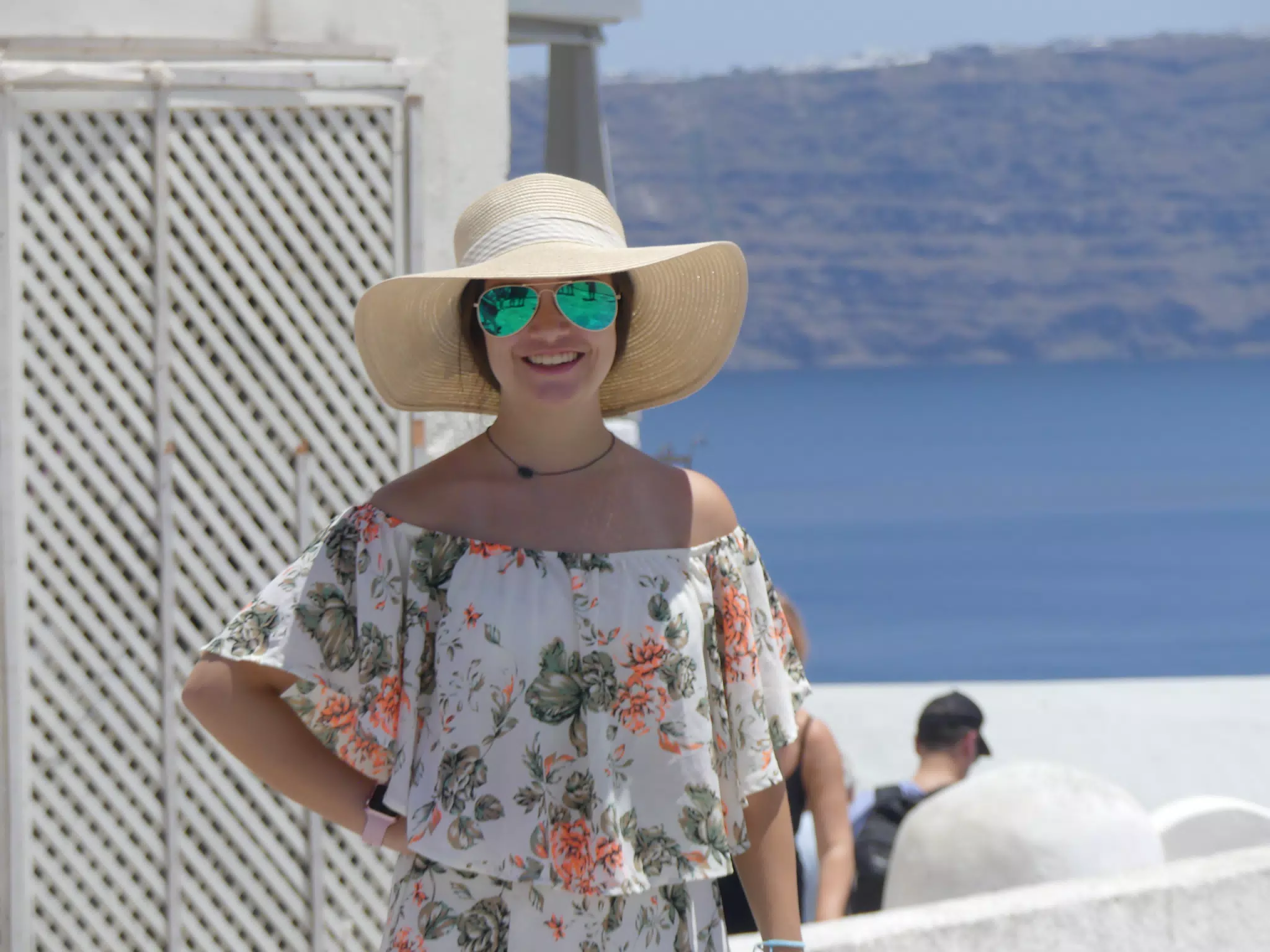 Emily in Hat in Oia, Santorini in Front of the Sea