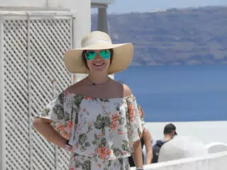 Emily in Hat in Oia, Santorini in Front of the Sea