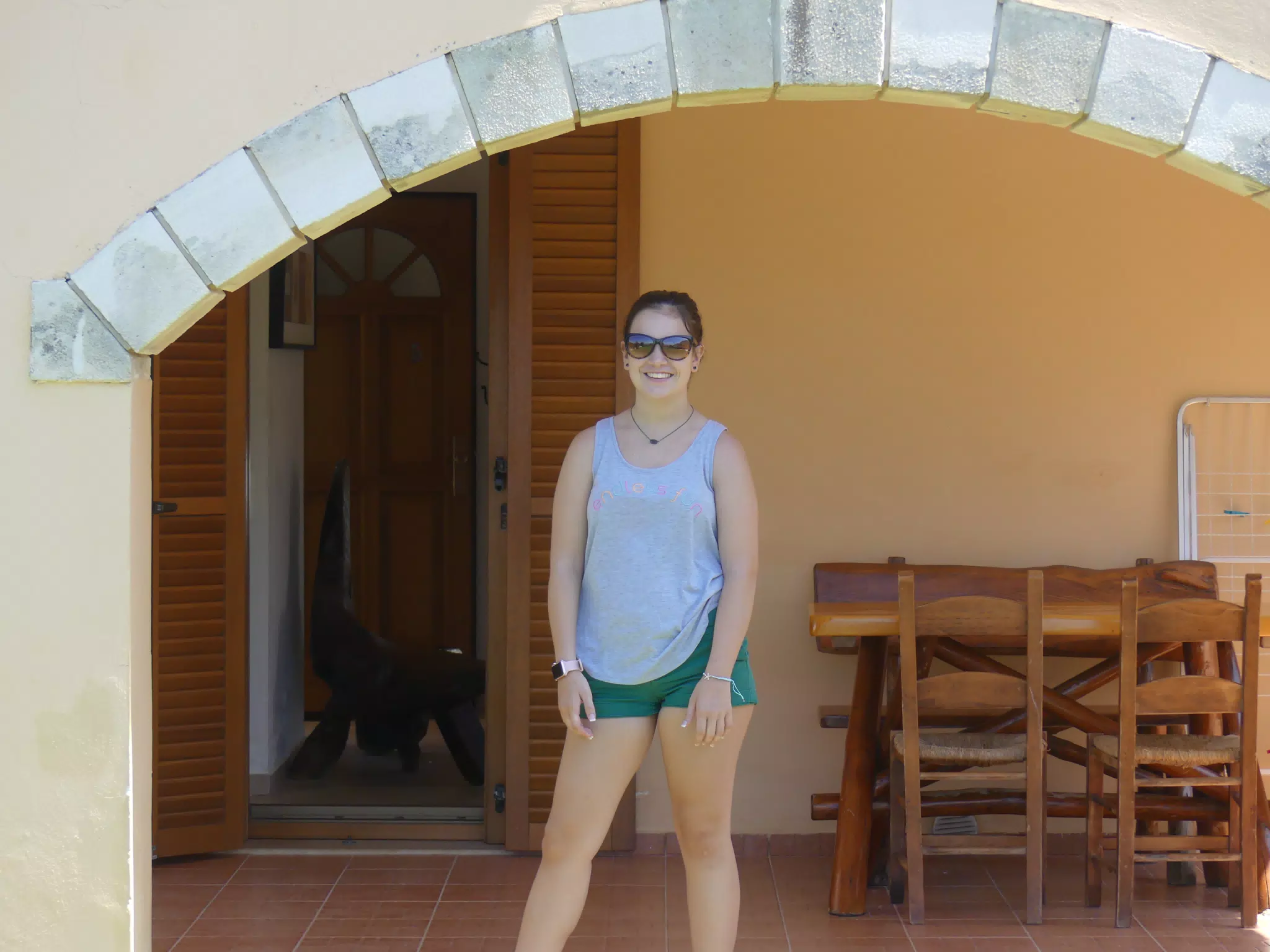 Emily at the Back Door of Our Aptera Apartment on Crete