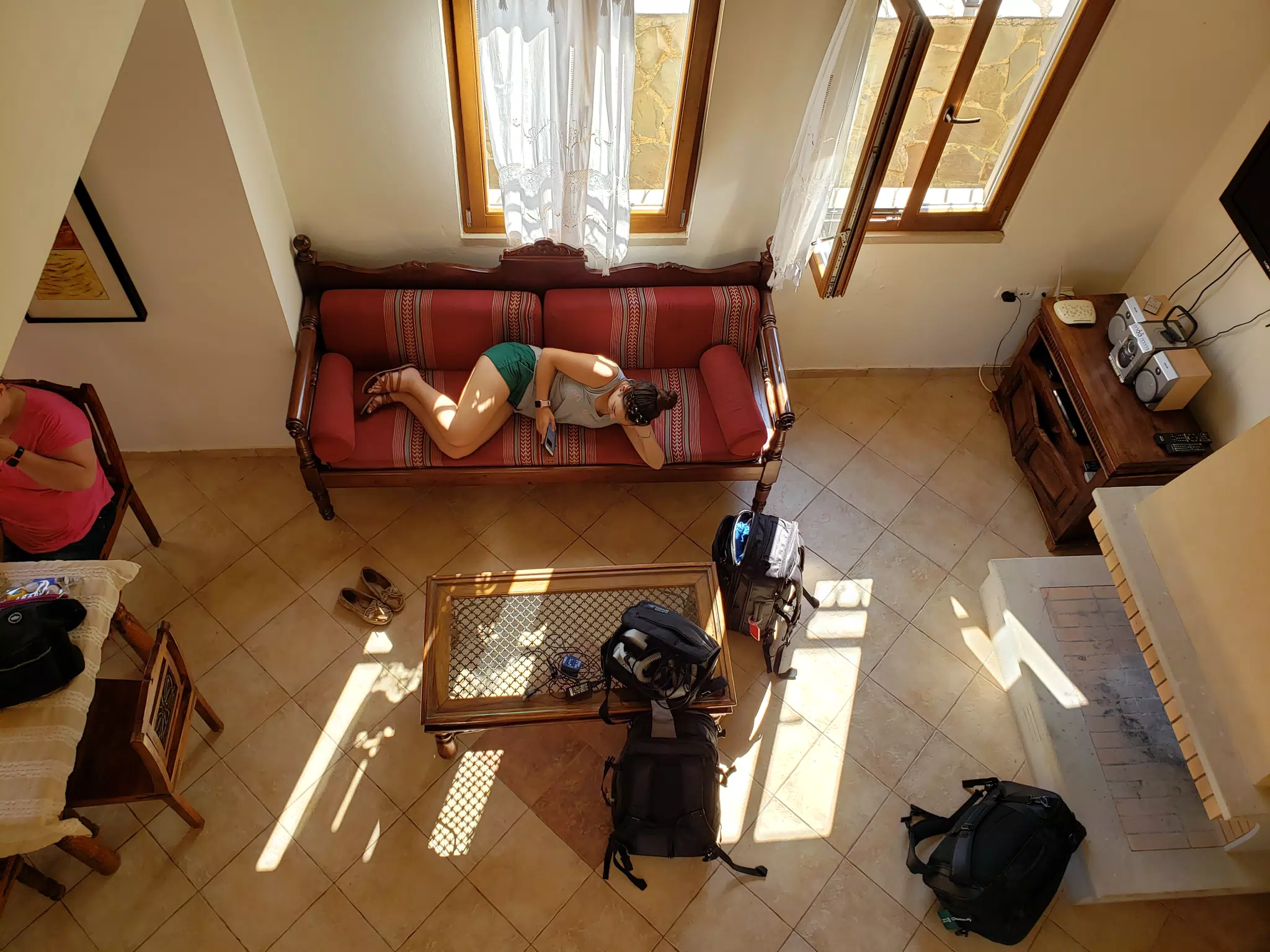 Emily Relaxing on Couch in Aptera Apartment on Crete