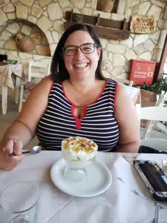 Dominica Eating Dessert at the Cretan Corner