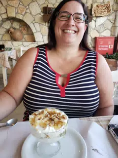 Dominica Eating Dessert at the Cretan Corner