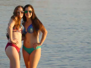 The Girls Posing by the Sea at Sunset