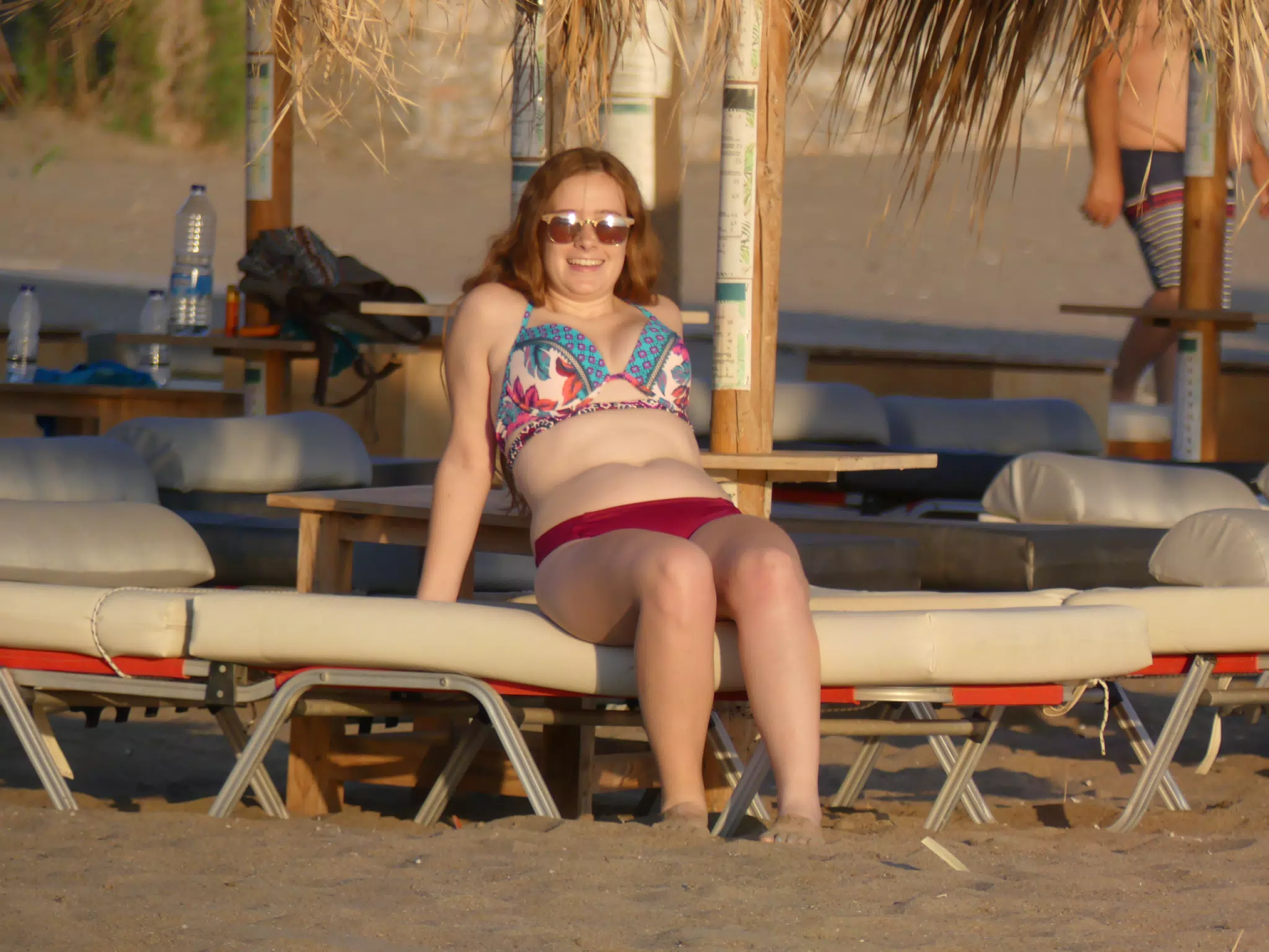 Madeline Relaxing at Sunset on Beach Chair on Greek Beach at Palaiochora