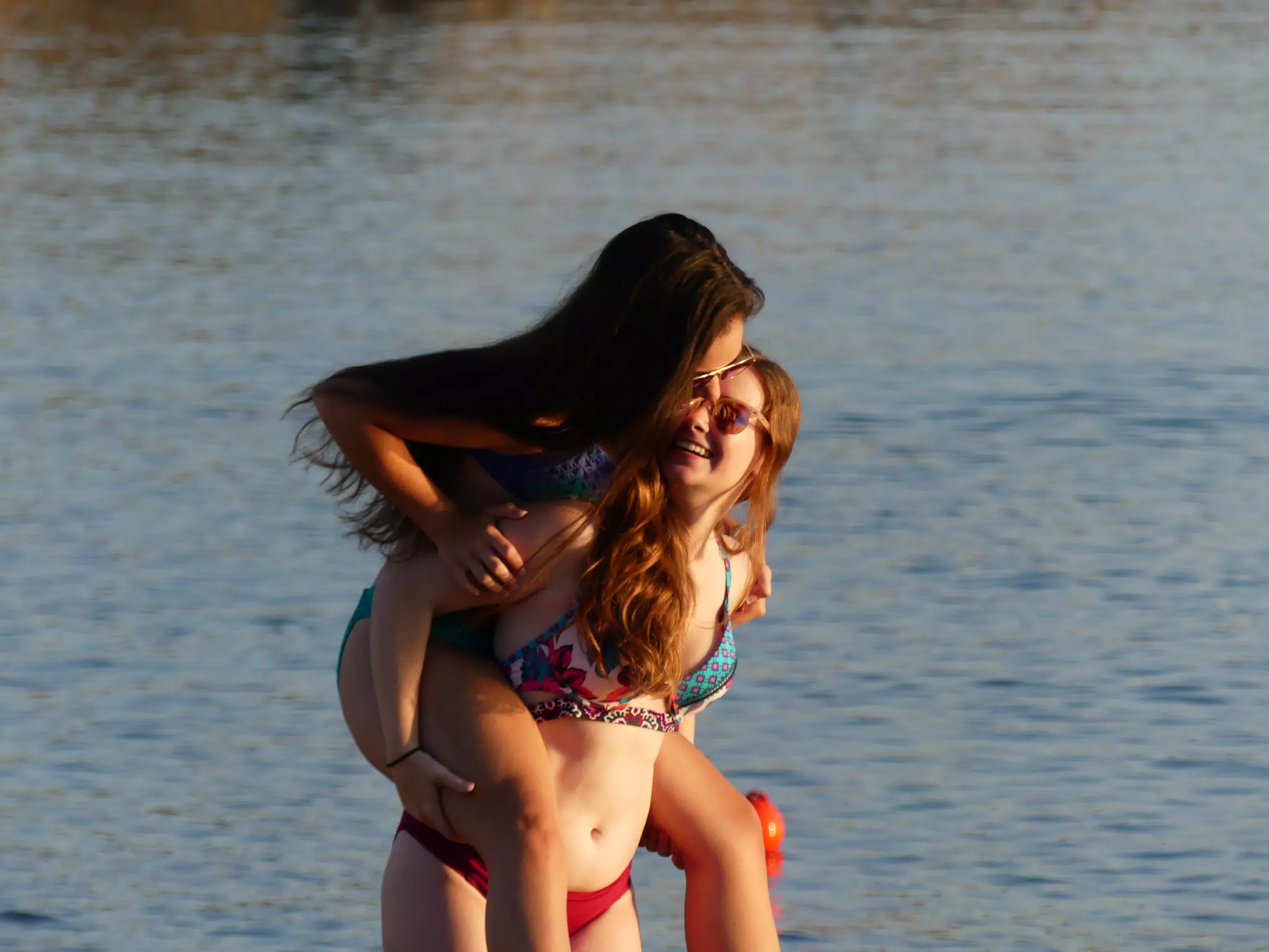 Emily Riding Madeline on Greek Beach