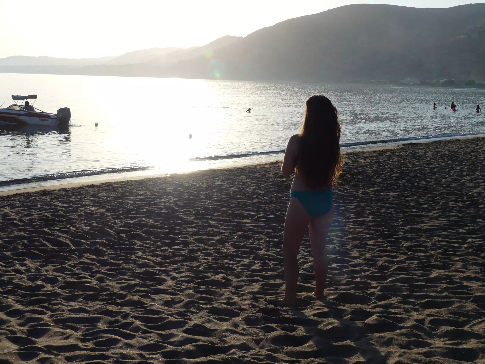 Emily Watching Sunset on Beach on Crete