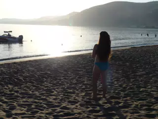 Emily Watching Sunset on Beach on Crete