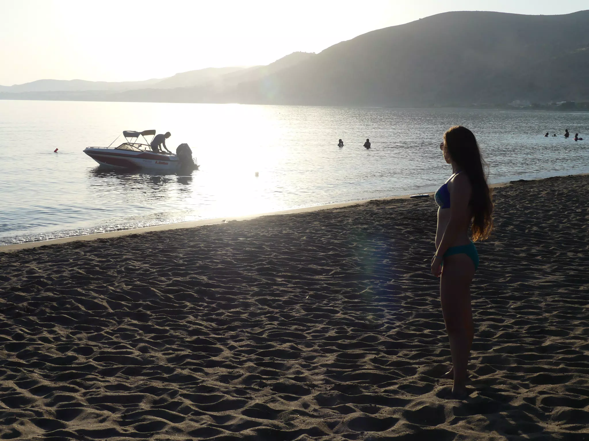 Girl in Bikini on Palaiochora Beach at Sunset