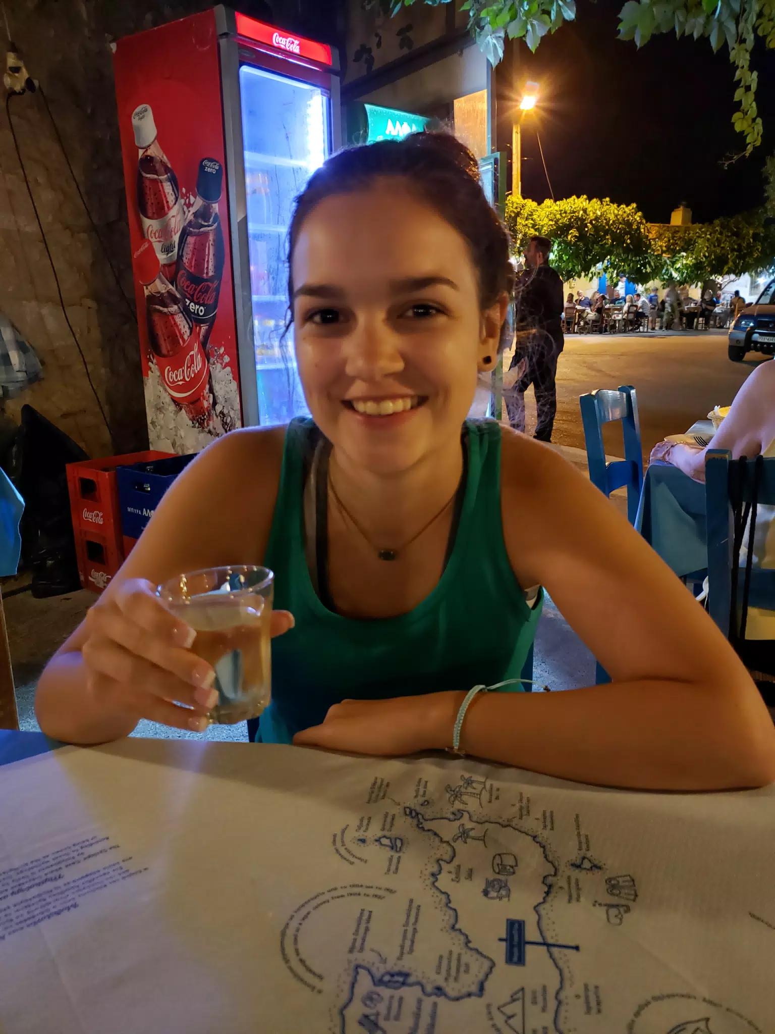 Emily Drinking Raki in Greek Taverna in Aptera, Crete