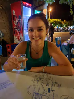 Emily Drinking Raki in Greek Taverna in Aptera, Crete