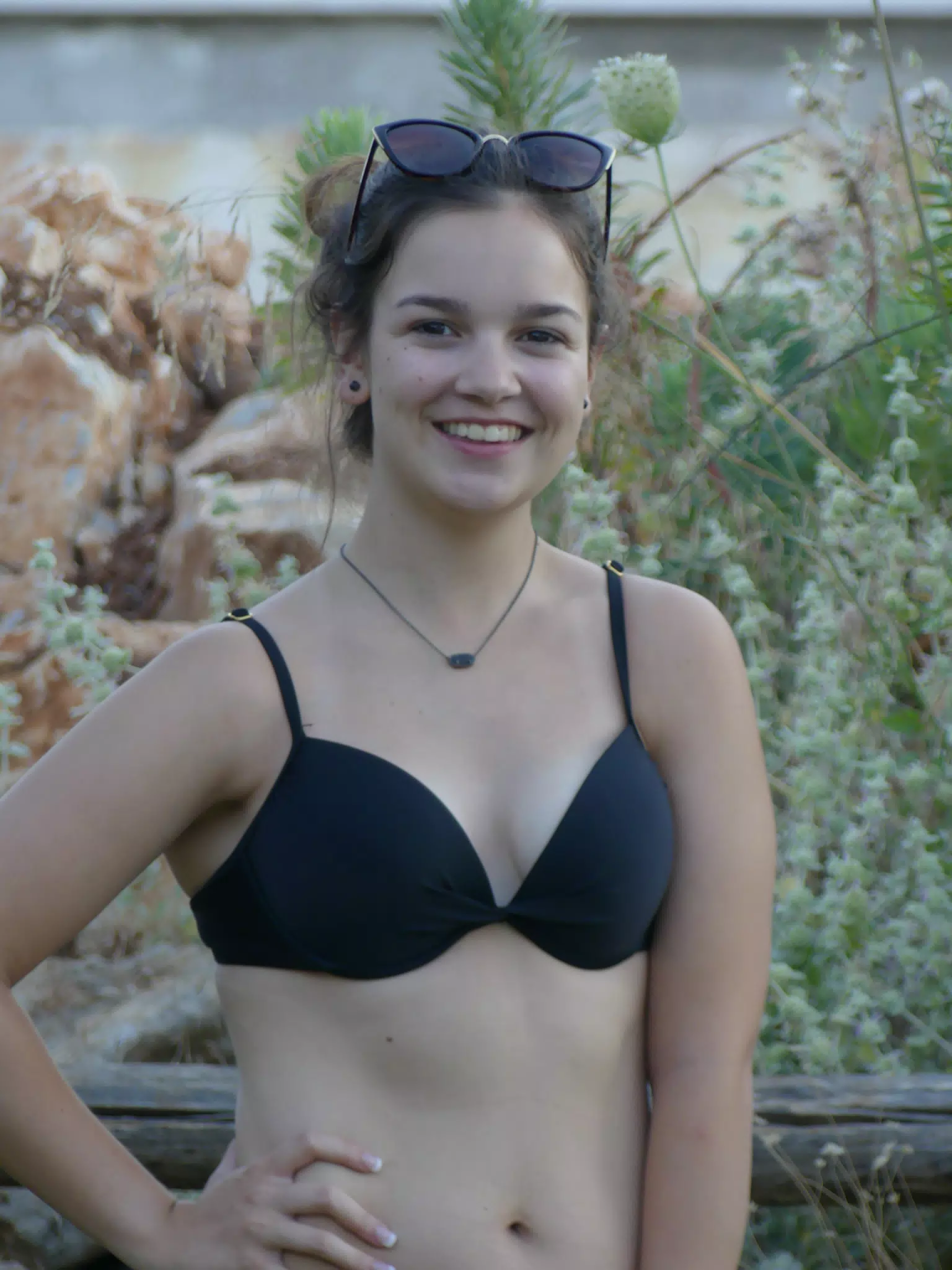 Emily Posing by Fence in Aptera