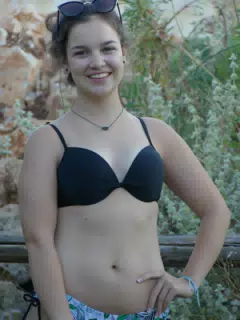 Girl Posing by Fence in Aptera