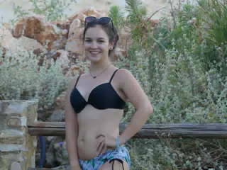 Emily Posing by Fence at Twilight in Aptera
