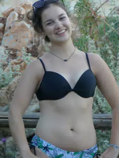 Emily Posing by Fence in Aptera