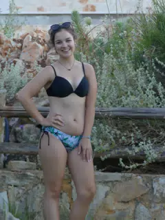 Emily Posing by Fence in Aptera