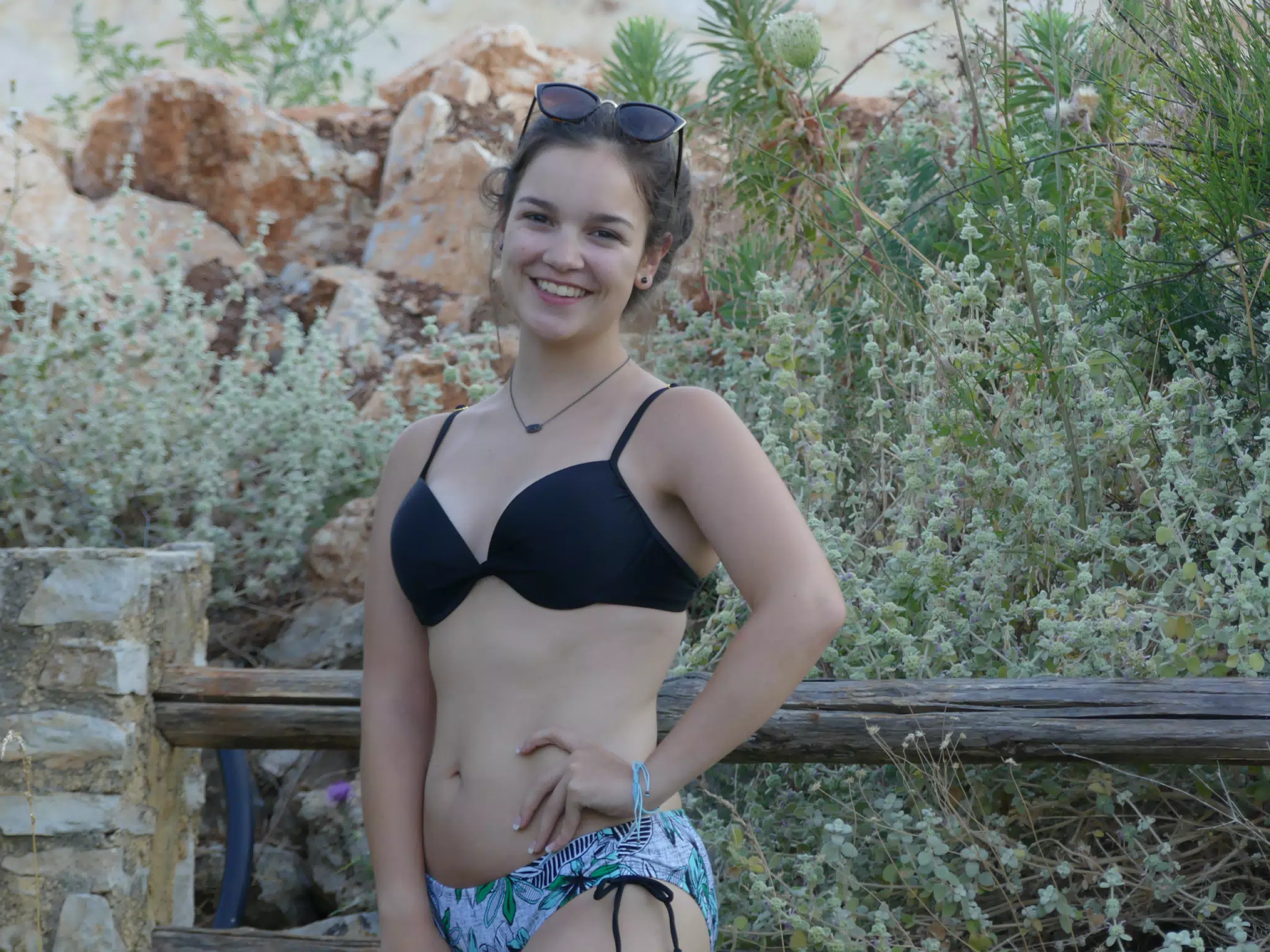Girl Posing by Fence in Aptera