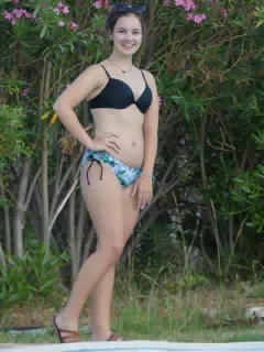 Girl in Aptera Wearing Sandals by Pool