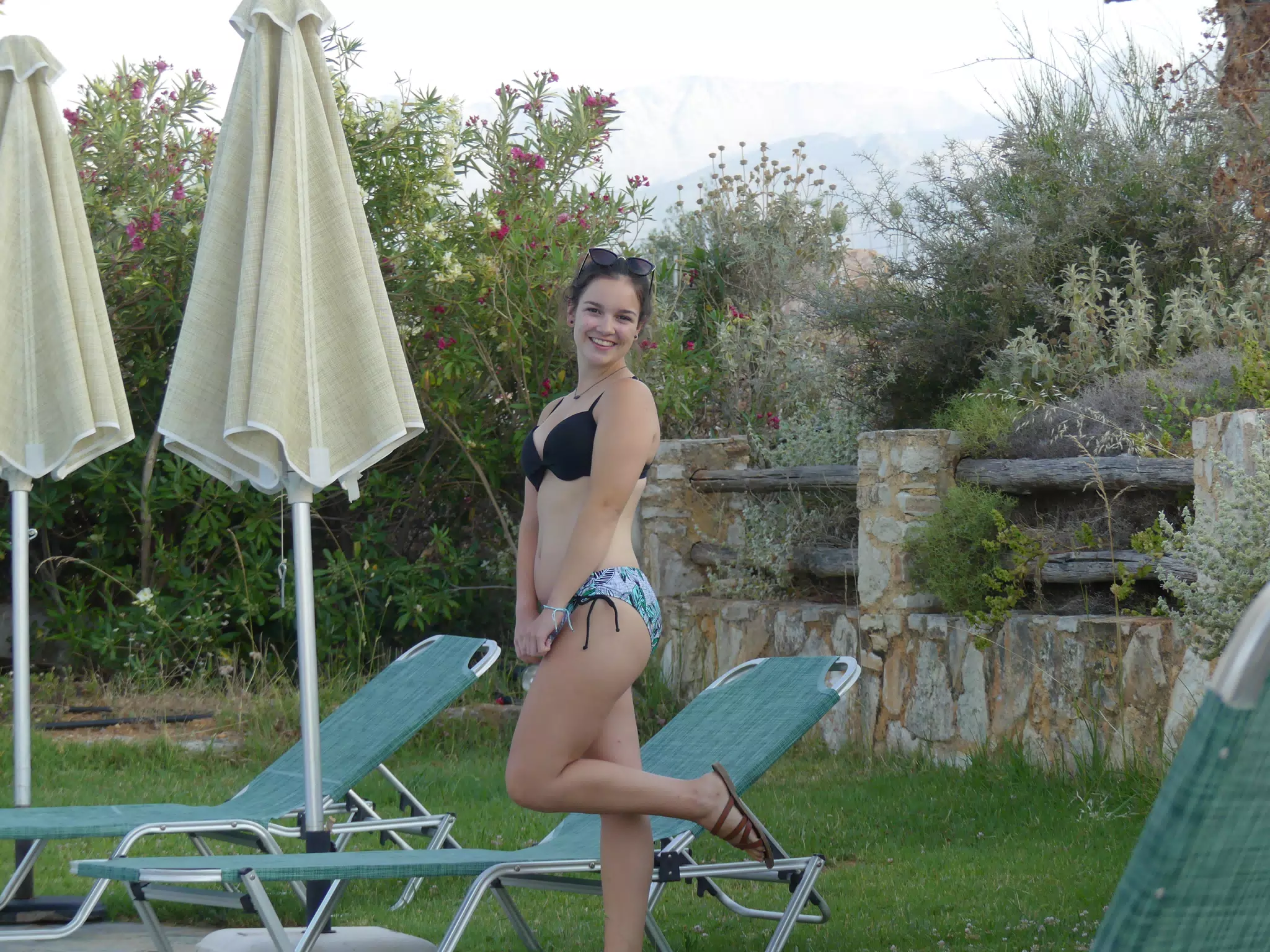 Girl Posing by Swimming Pool in Aptera
