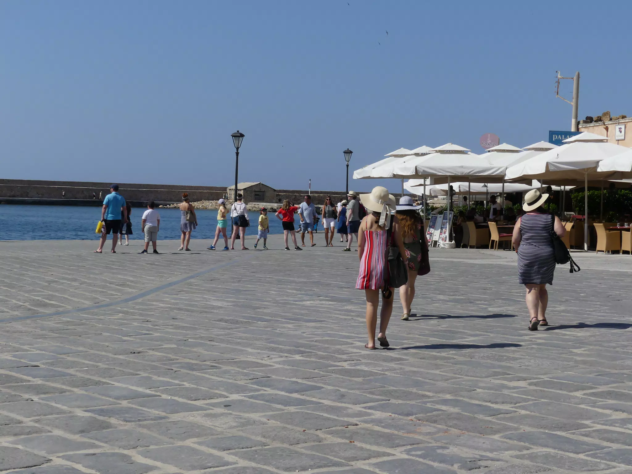 The Girls Walking in the Venetian Harbor at Chania