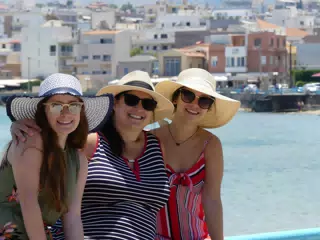 Madeine, Dominica & Emily in Chania by Waterfront Posing in Hats