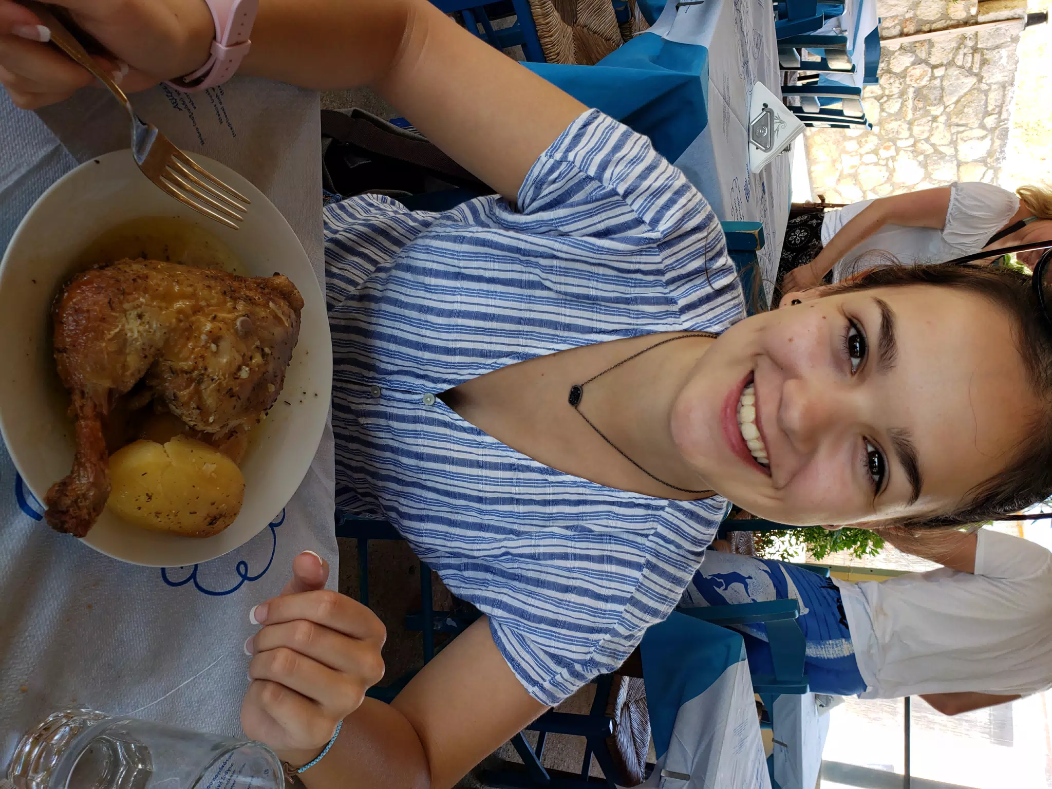 Emily with Grilled Chicken in Taverna in Aptera, Crete