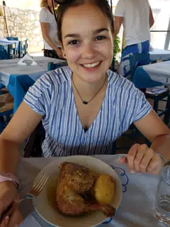Emily with Grilled Chicken in Taverna in Aptera, Crete
