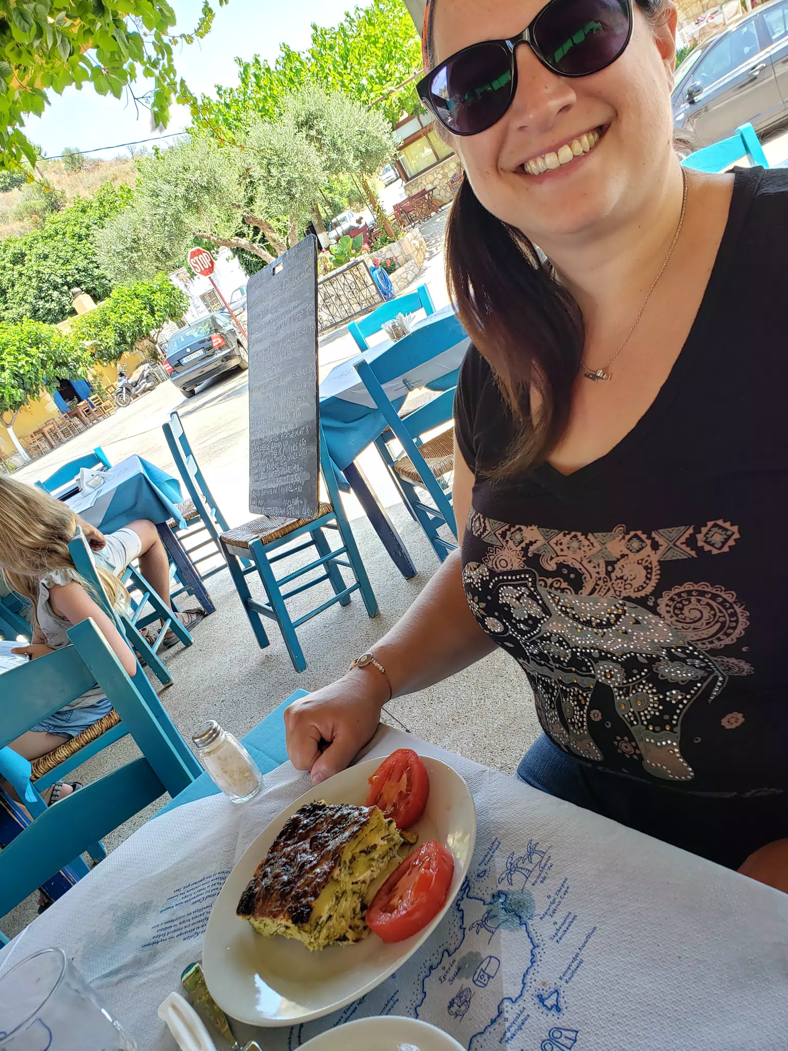 Dominica Eating in Taverna in Aptera, Crete