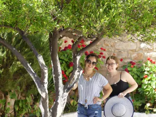 Emily & Madeline Under Tree in Courtyard in Ancient Aptera