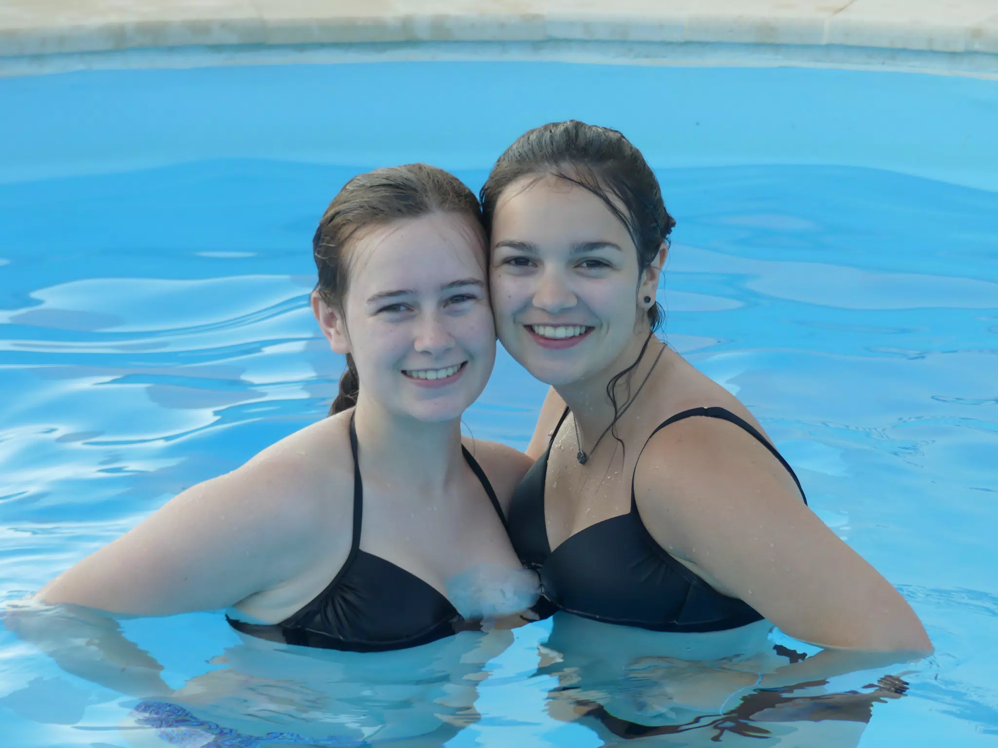 Madeline & Emily in Swimming Pool at Aptera Apartment