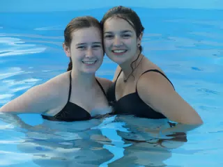 Madeline & Emily in Swimming Pool at Aptera Apartment