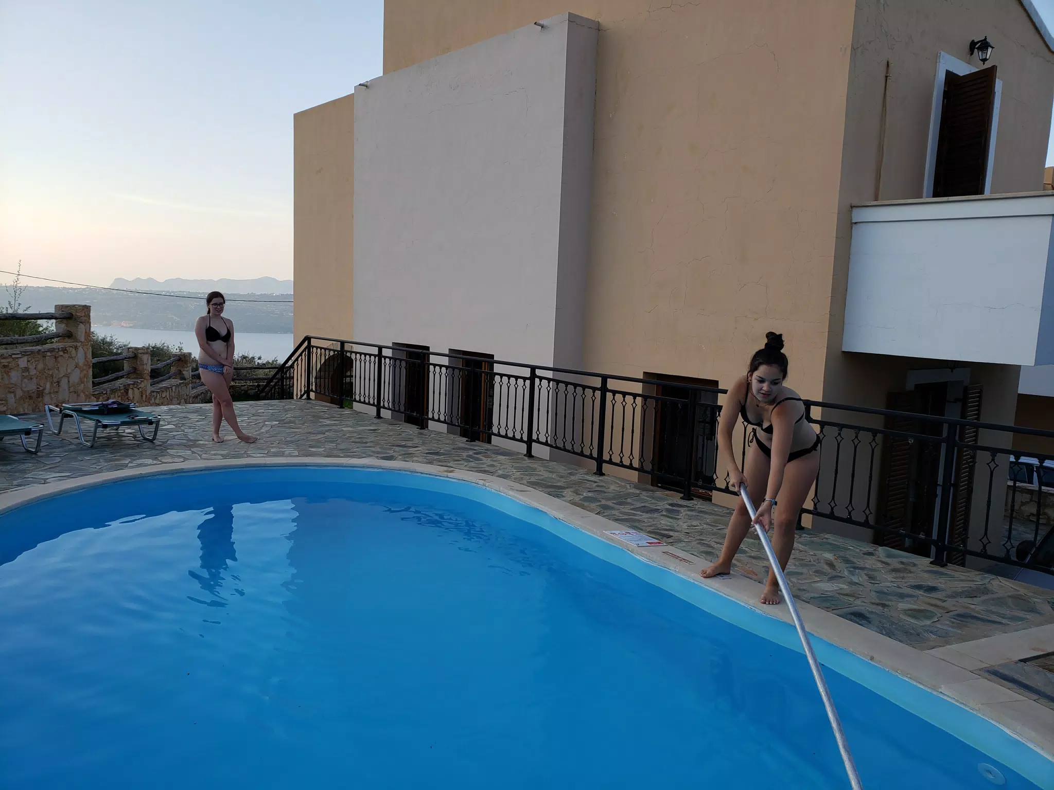 Emily Cleaning the Pool in Aptera