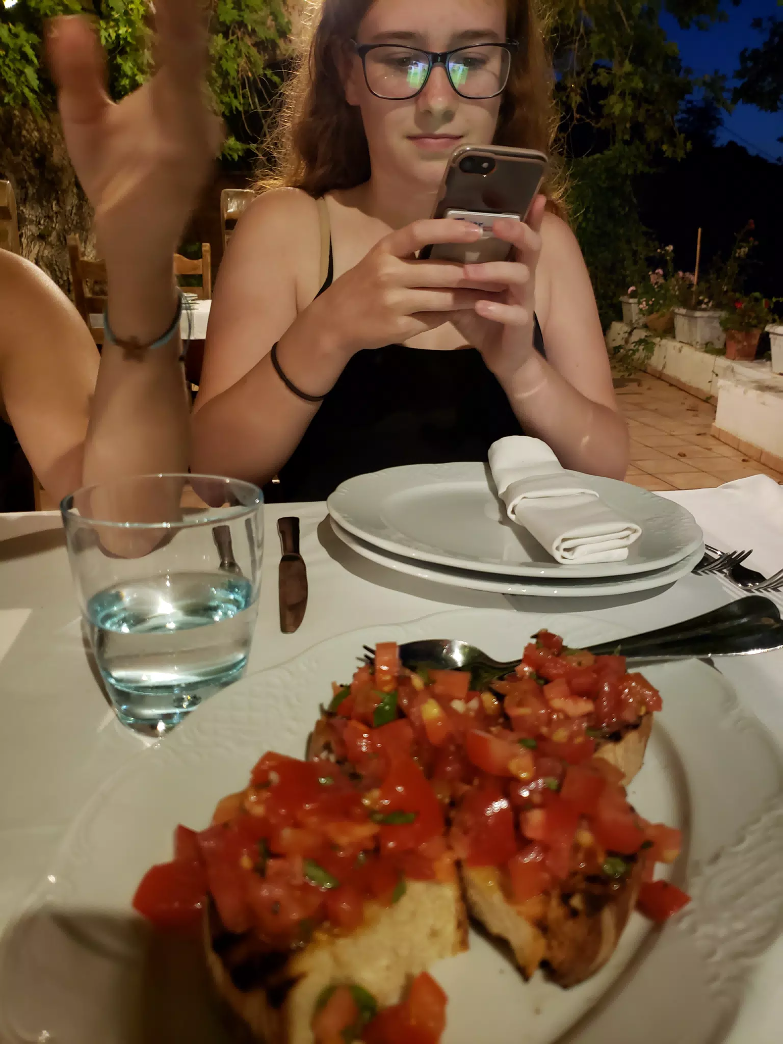 Madeline Instagramming Dinner